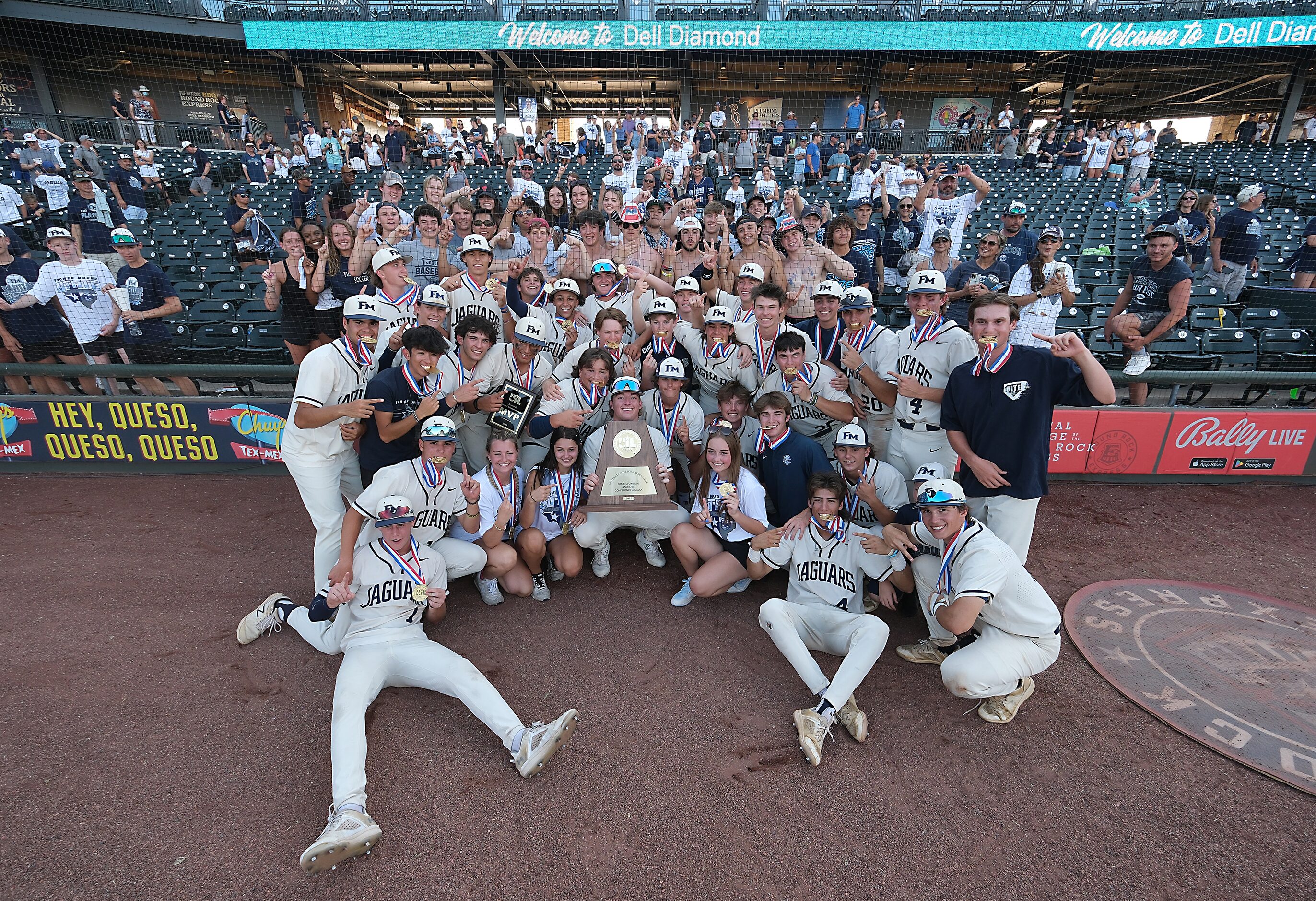 The Flower Mound team pose with fans after defeating Pearland during in the 2023 UIL State...