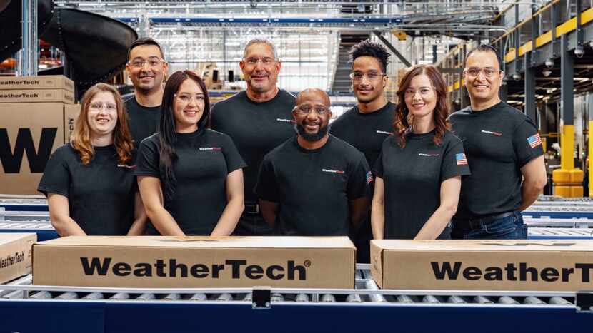WeatherTech employees in a scene from its Super Bowl ad.