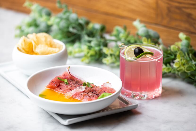 Dinner at Saint Ann in Dallas could mean tuna crudo with a cocktail to match. The pink drink...