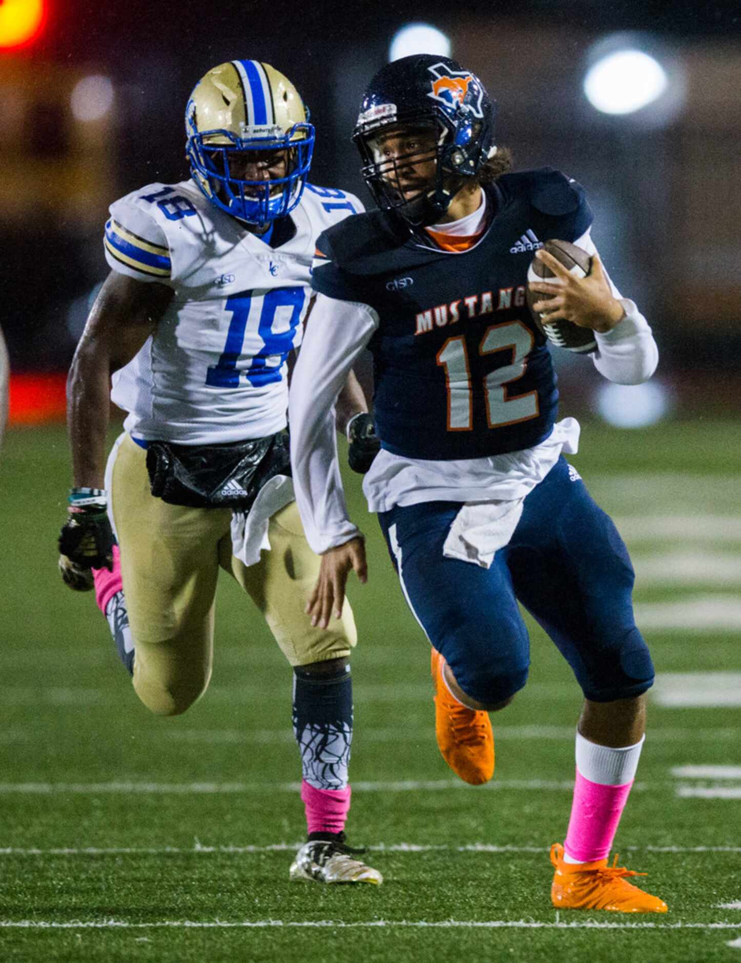 Sachse quarterback Xavier Forman (12) runs the ball ahead of Garland Lakeview linebacker...