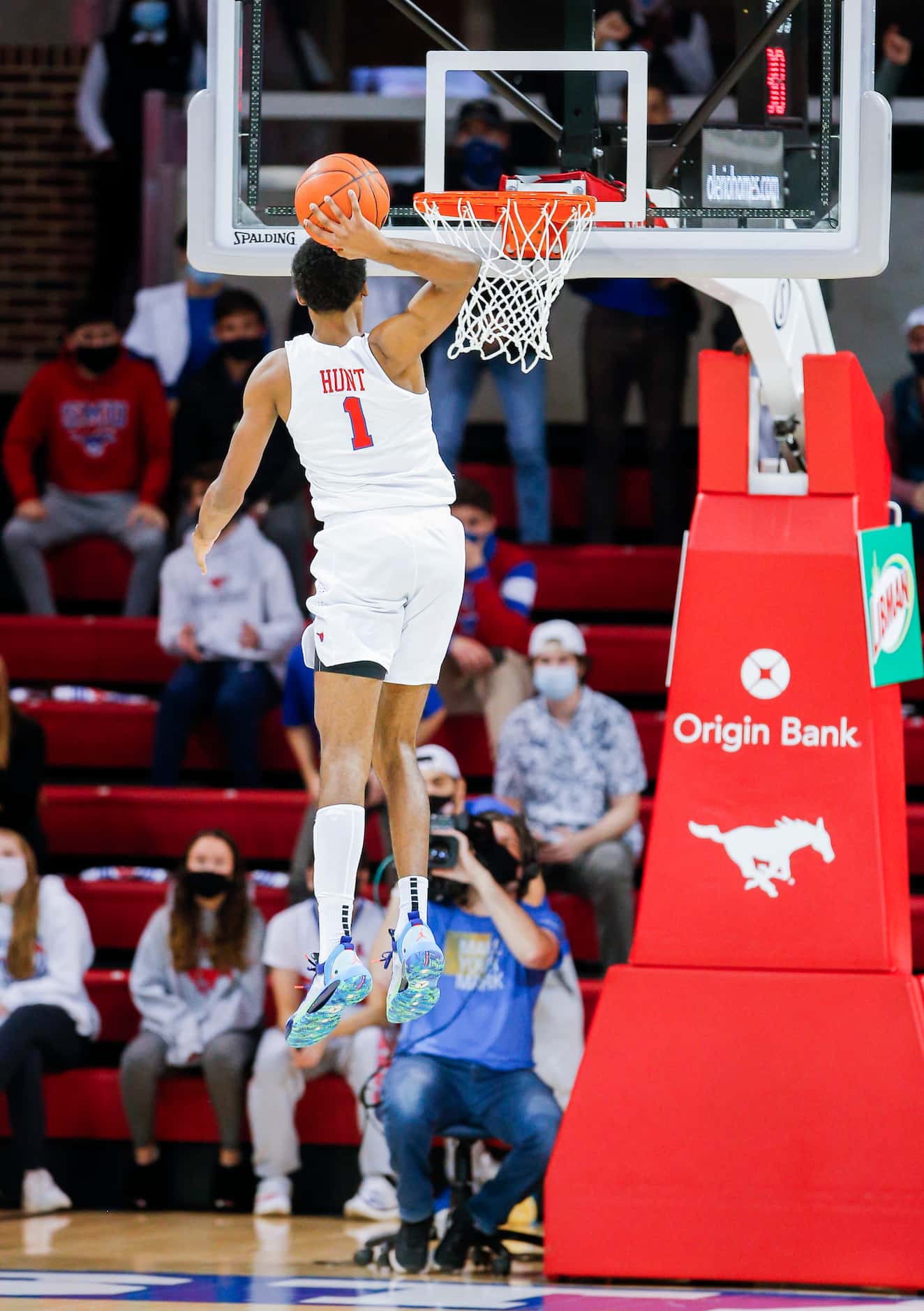 SMU forward Feron Hunt (1) dunks on a breakaway during the first half of a college...