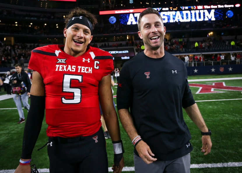 Texas Tech quarterback Patrick Mahomes II (5) and head coach Kliff Kingsbury walk off the...