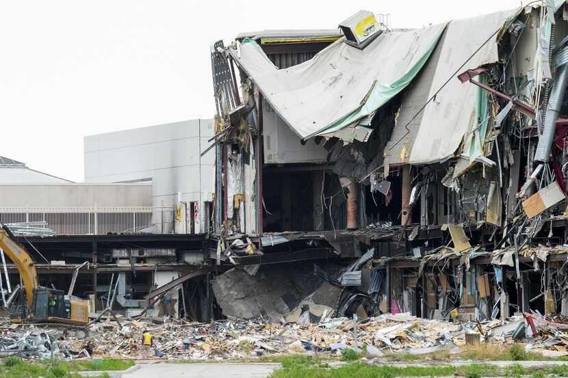 Crews from Lindamood Demolition work at the site of the former Valley View Mall on Thursday.