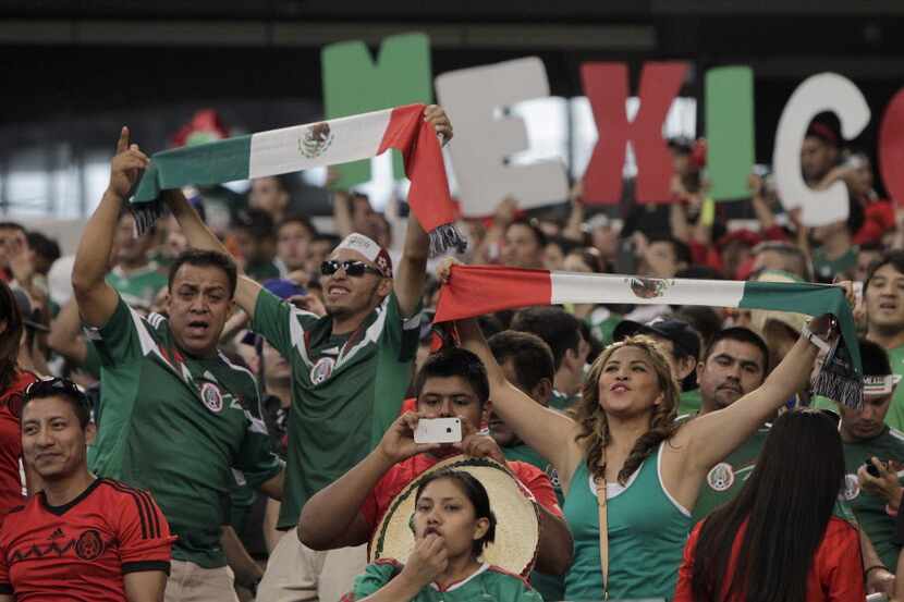 Mexico fans celebrate a 3-1 win against Ecuador in the second half of international futbol...