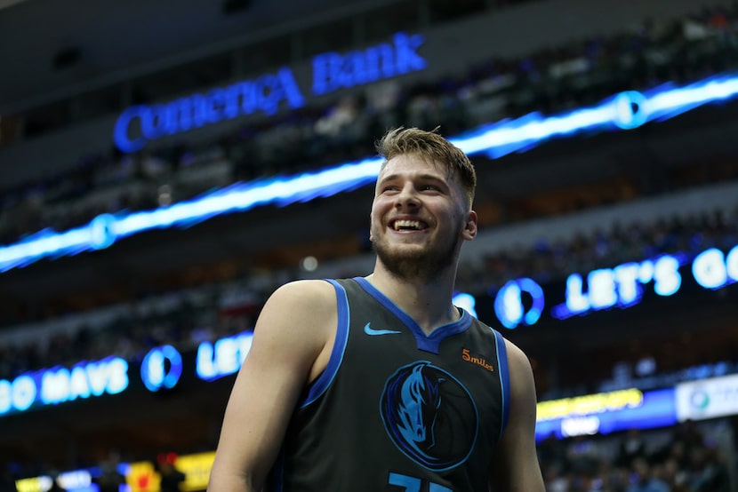 Dallas Mavericks forward Luka Doncic (77) smiles in the third quarter at the American...