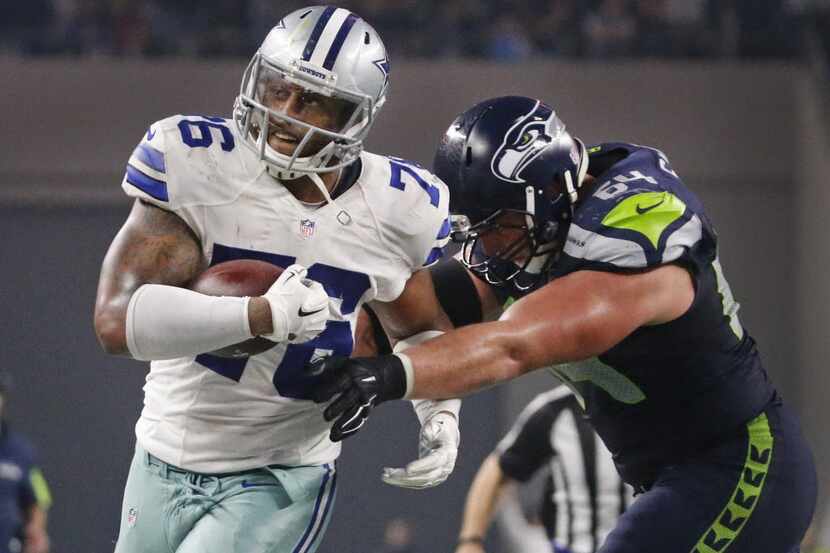 Dallas Cowboys defensive end Greg Hardy (76) returns his interception during the Seattle...
