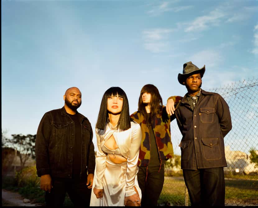 The Houston band Khruangbin poses for a publicity photo with Leon Bridges.