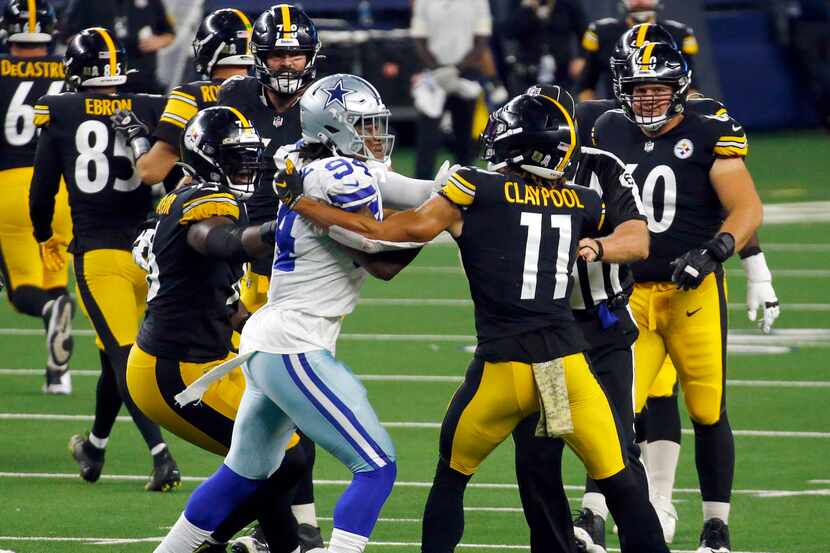Dallas Cowboys defensive end Randy Gregory (94) and Pittsburgh Steelers wide receiver Chase...