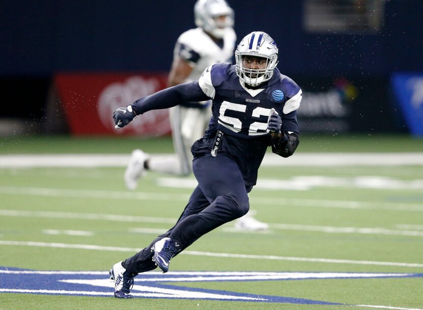 FILE - Dallas Cowboys linebacker Justin Durant (52) pursues the ball on a play at practice...