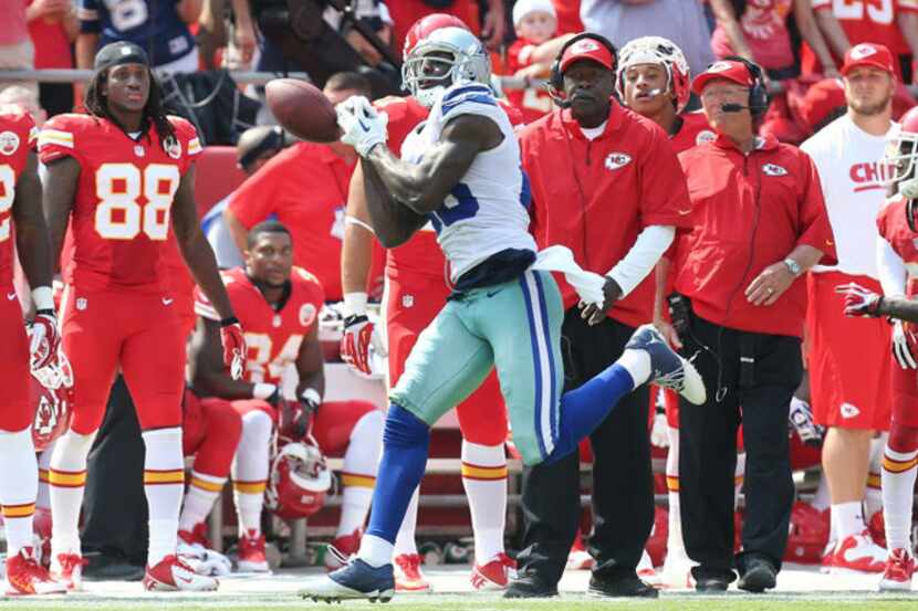 The Kansas City bench watches as Dallas Cowboys wide receiver Dez Bryant (88) can't get the...