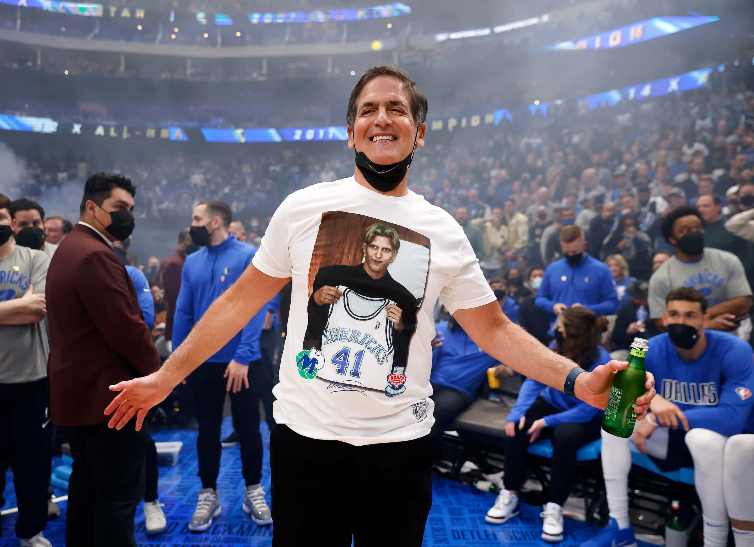 Former Dallas Mavericks All-Star Dirk Nowitzki and his family watch as his jersey is lifted...