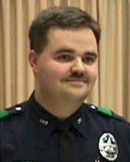 Officer Aubrey Hawkins was killed as he investigated a robbery at an Oshman's Sporting Goods...