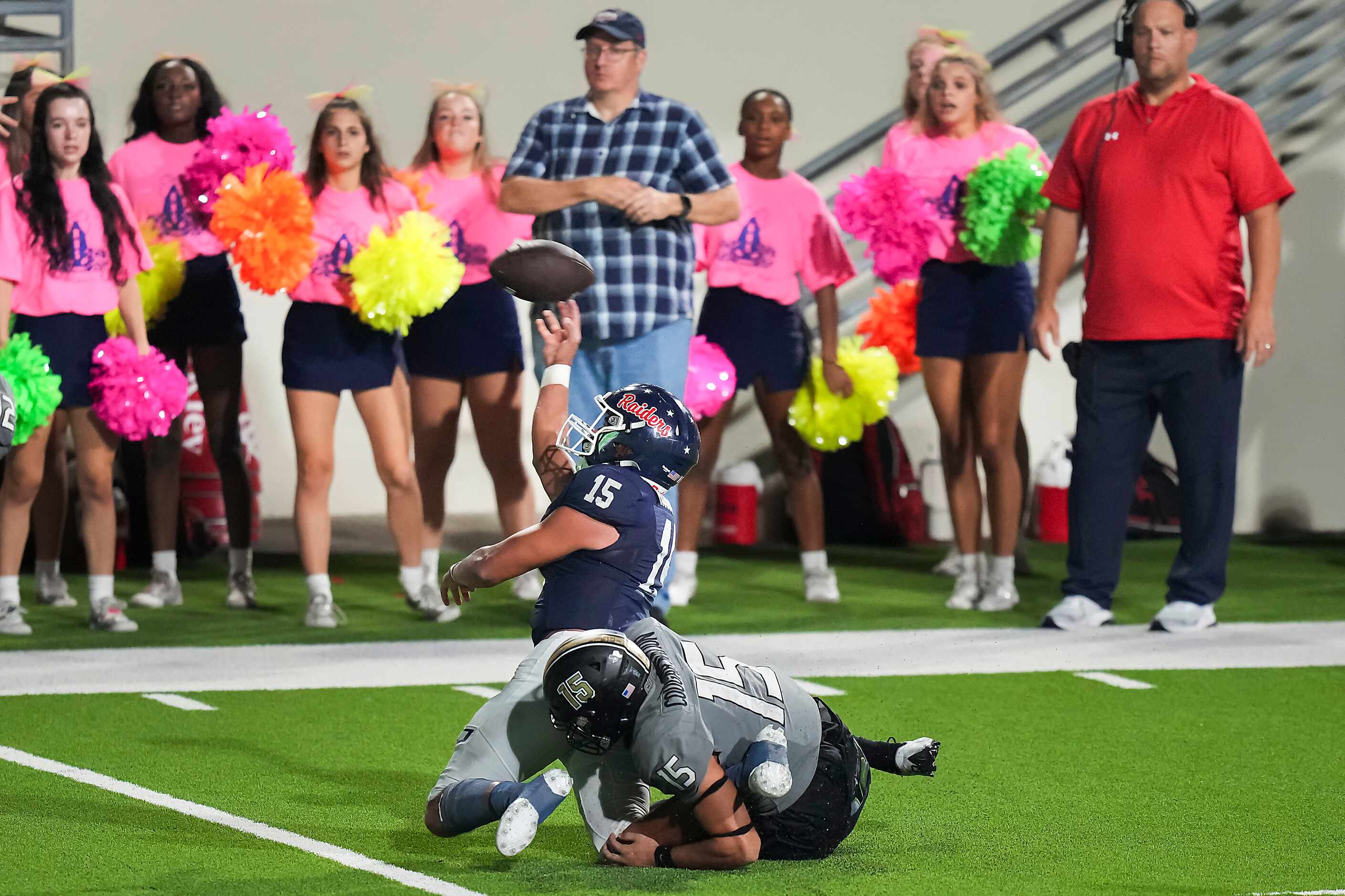 On a fourth-and-goal from The Colony six-yard line, Denton Ryan quarterback TJ Hobbs (15) is...
