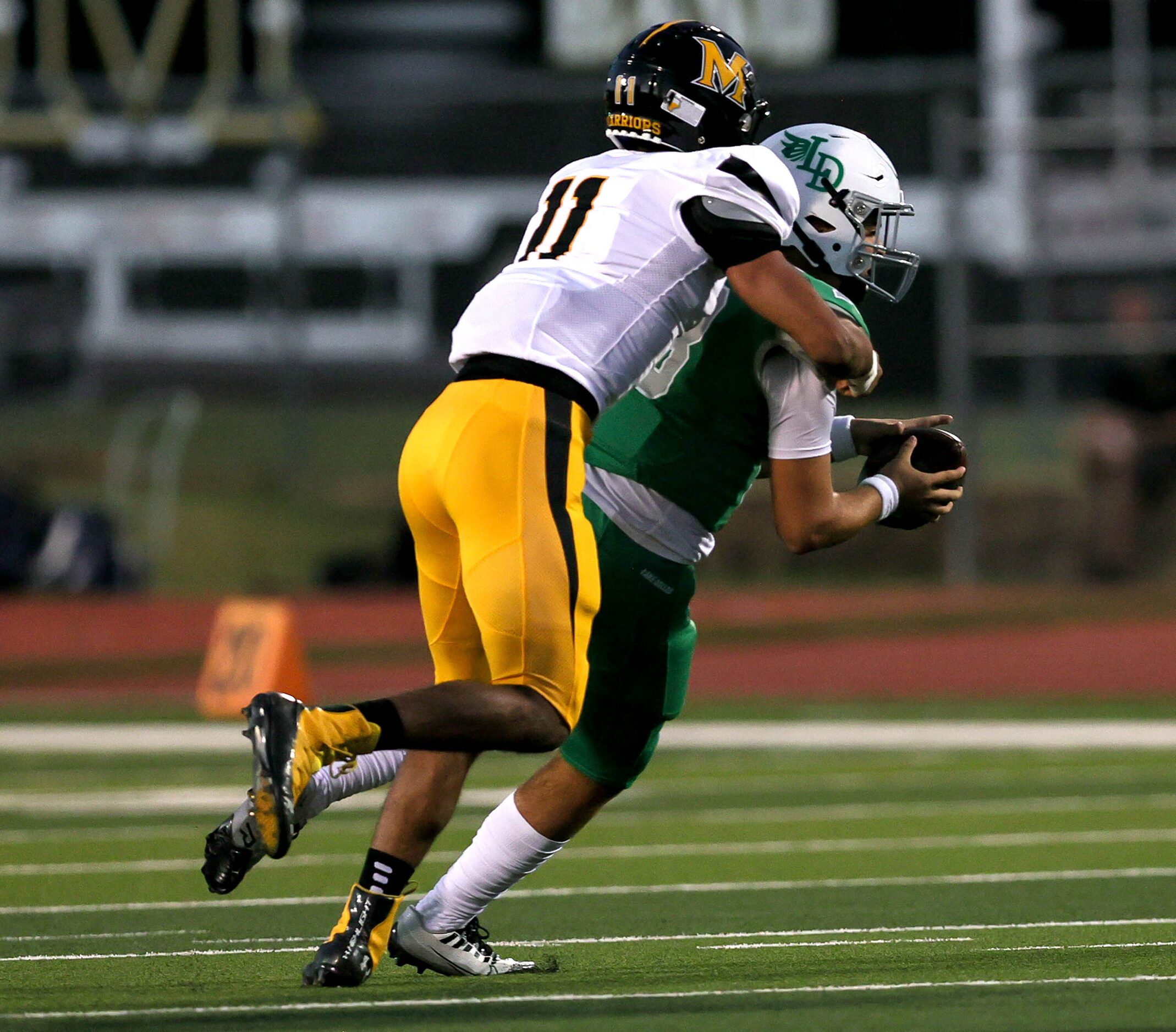 Frisco Memorial linebacker Kennedy McDowell (11) sacks Lake Dallas quarterback Cade Bortnem...