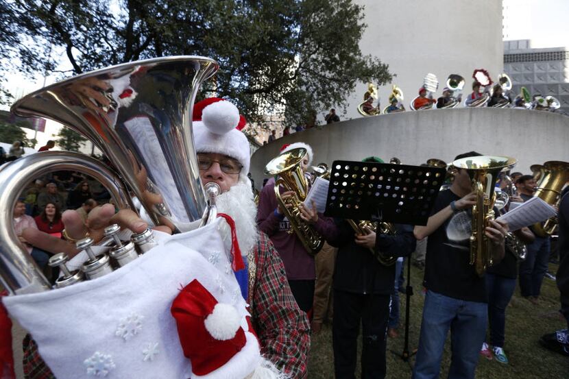 Warren Brooks from Fairview, Texas, plays the euphonium during a TubaChristmas concert at...