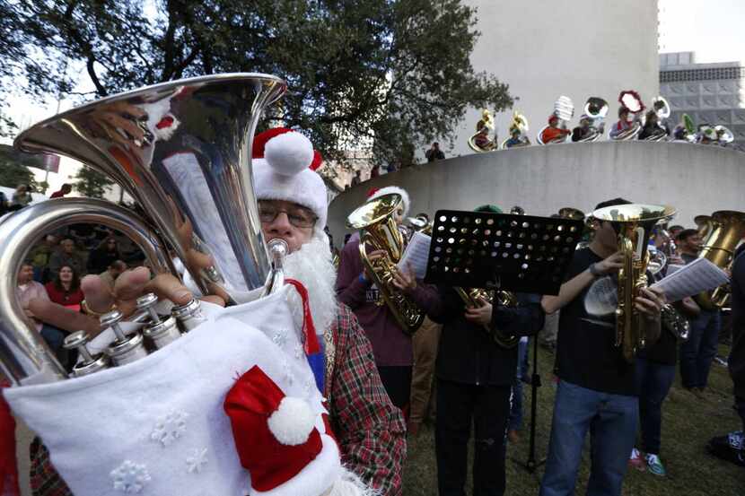 Warren Brooks from Fairview, Texas, plays the euphonium during a TubaChristmas concert at...