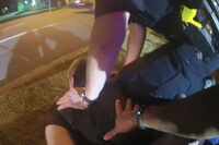 Tony Timpa is restrained on the ground by Dallas police officers in a still image taken from...