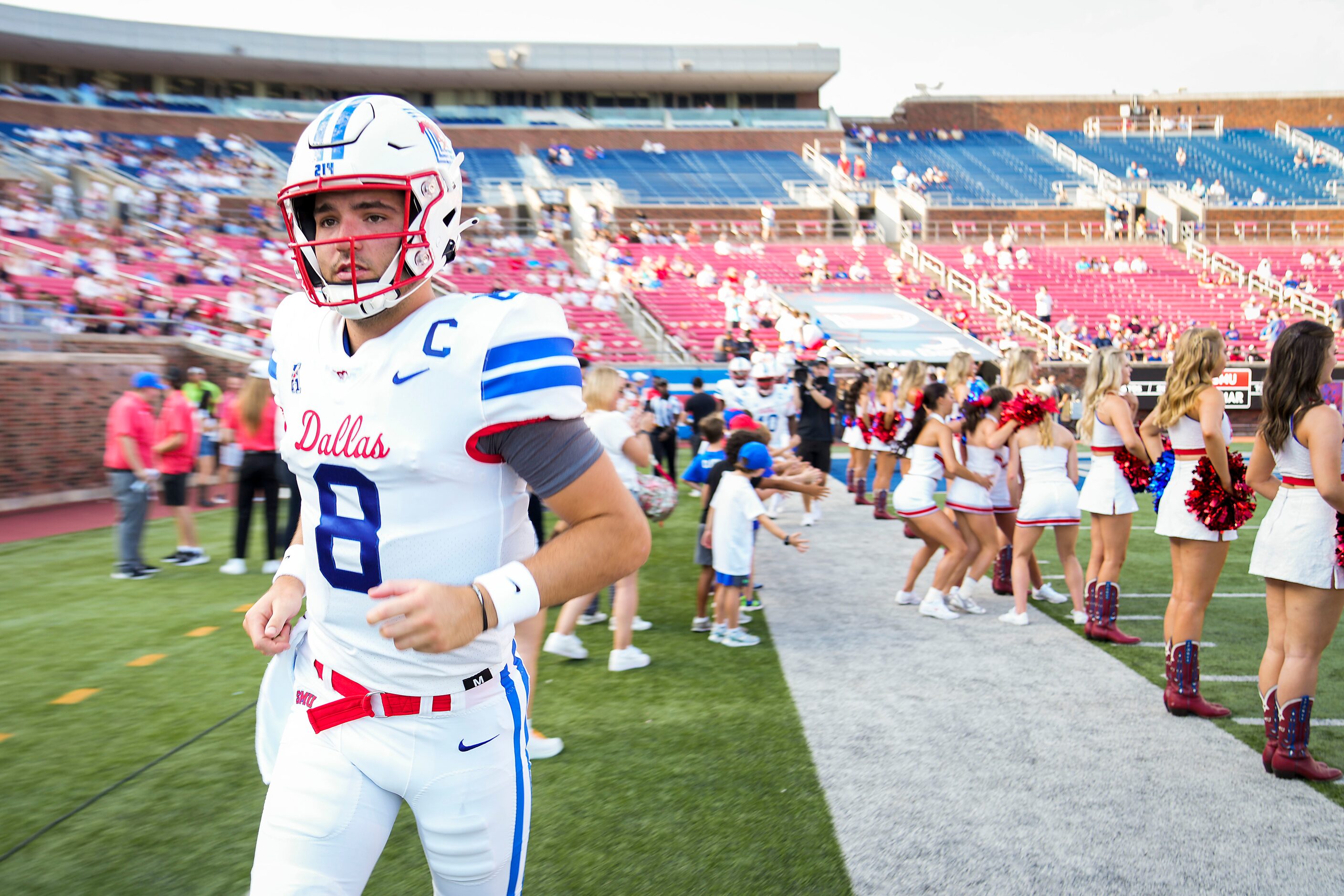 SMU quarterback Tanner Mordecai (8) takes the field before an NCAA football game between...