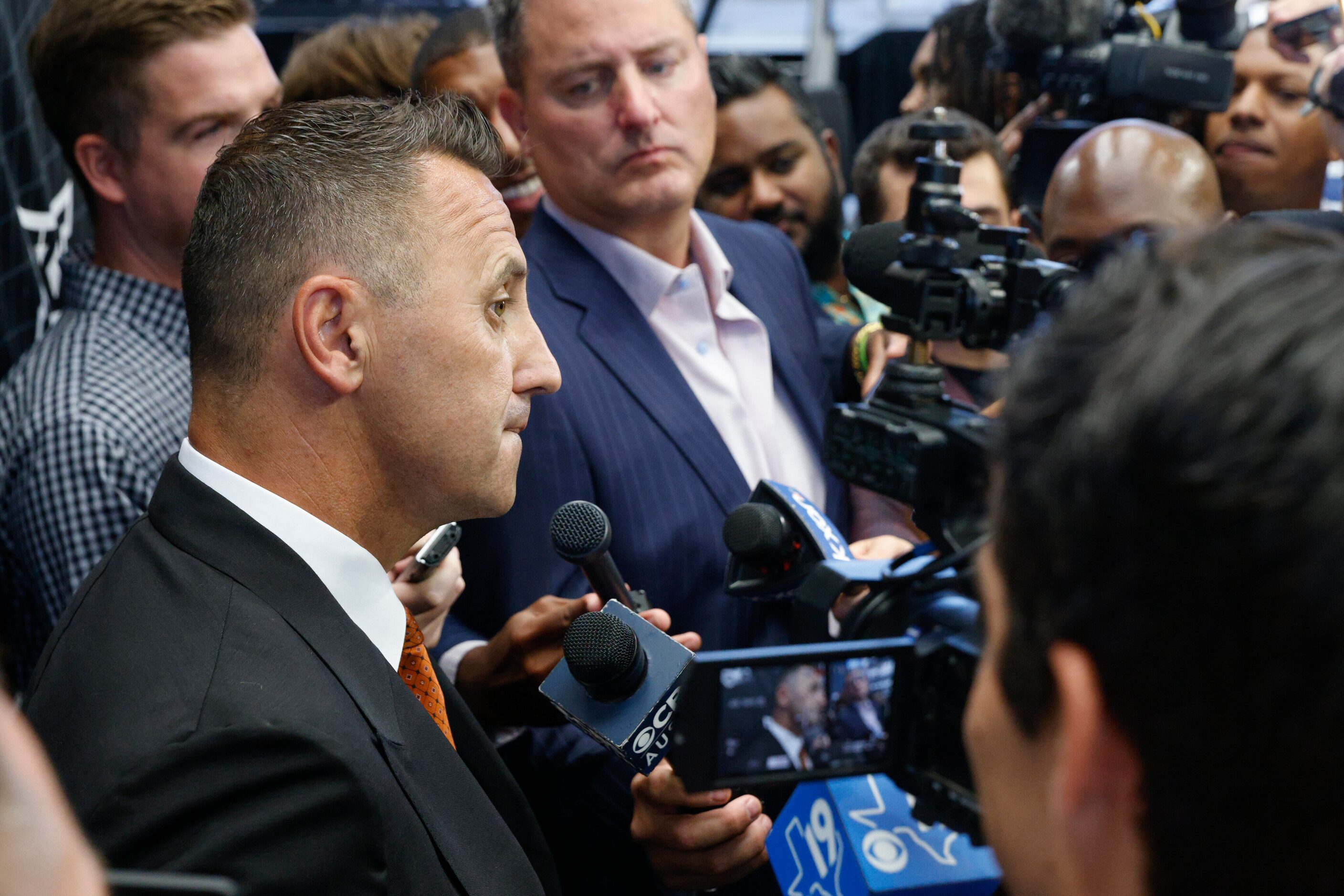 Texas head coach Steve Sarkisian (left) speaks with members of the media during the Big 12...