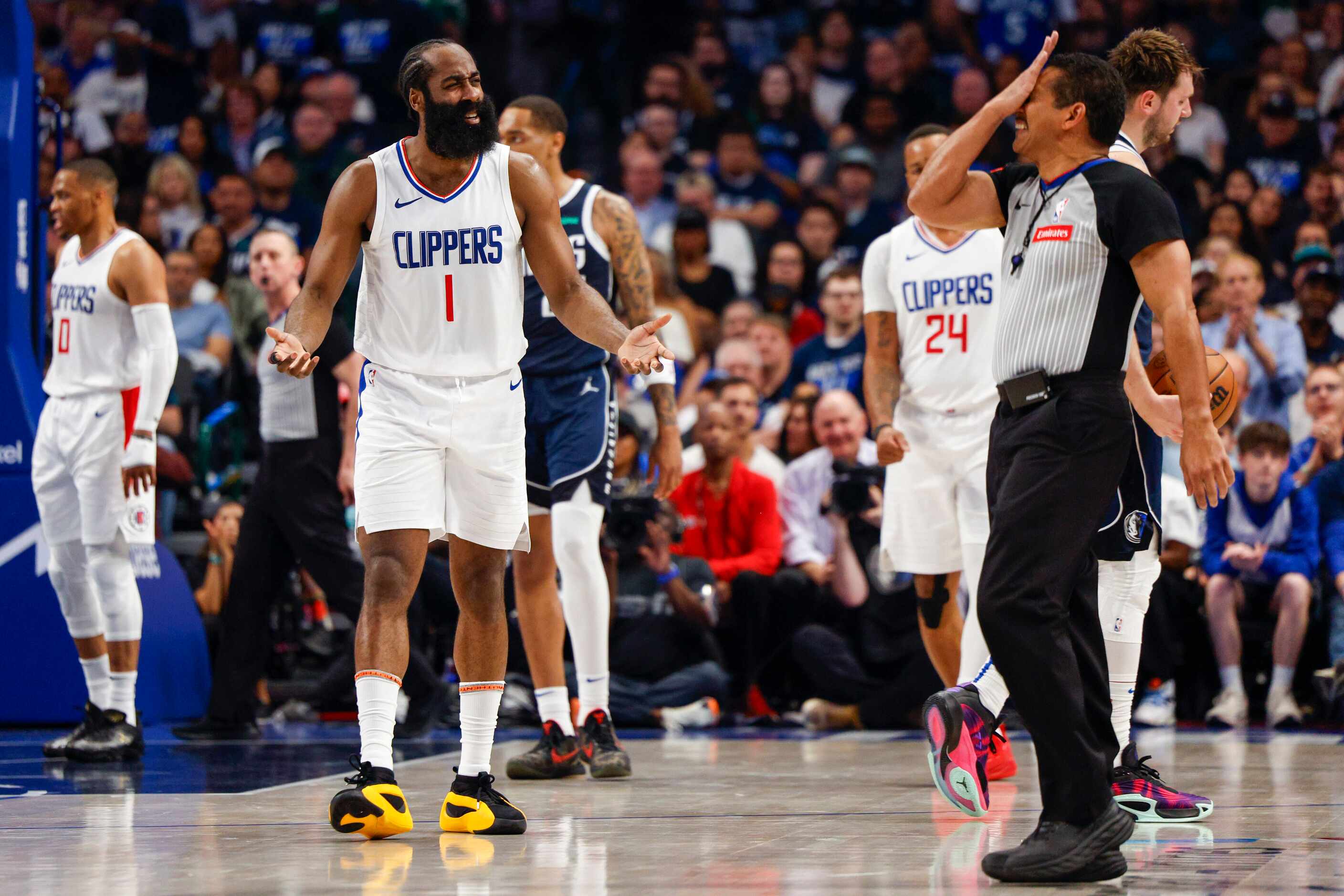 LA Clippers guard James Harden (1) reacts after being called for a foul on Dallas Mavericks...
