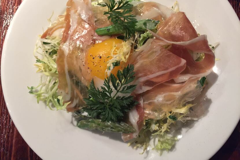 Kyle McClelland's Italian frisée salad at Vicini American-Italian Kitchen and Bar, which has...