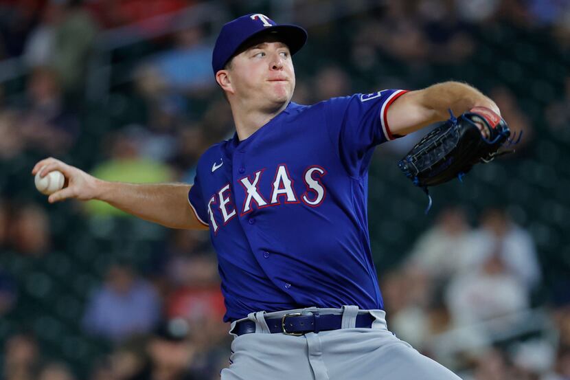 Texas Rangers relief pitcher Josh Sborz throws to a Minnesota Twins batter during the eighth...