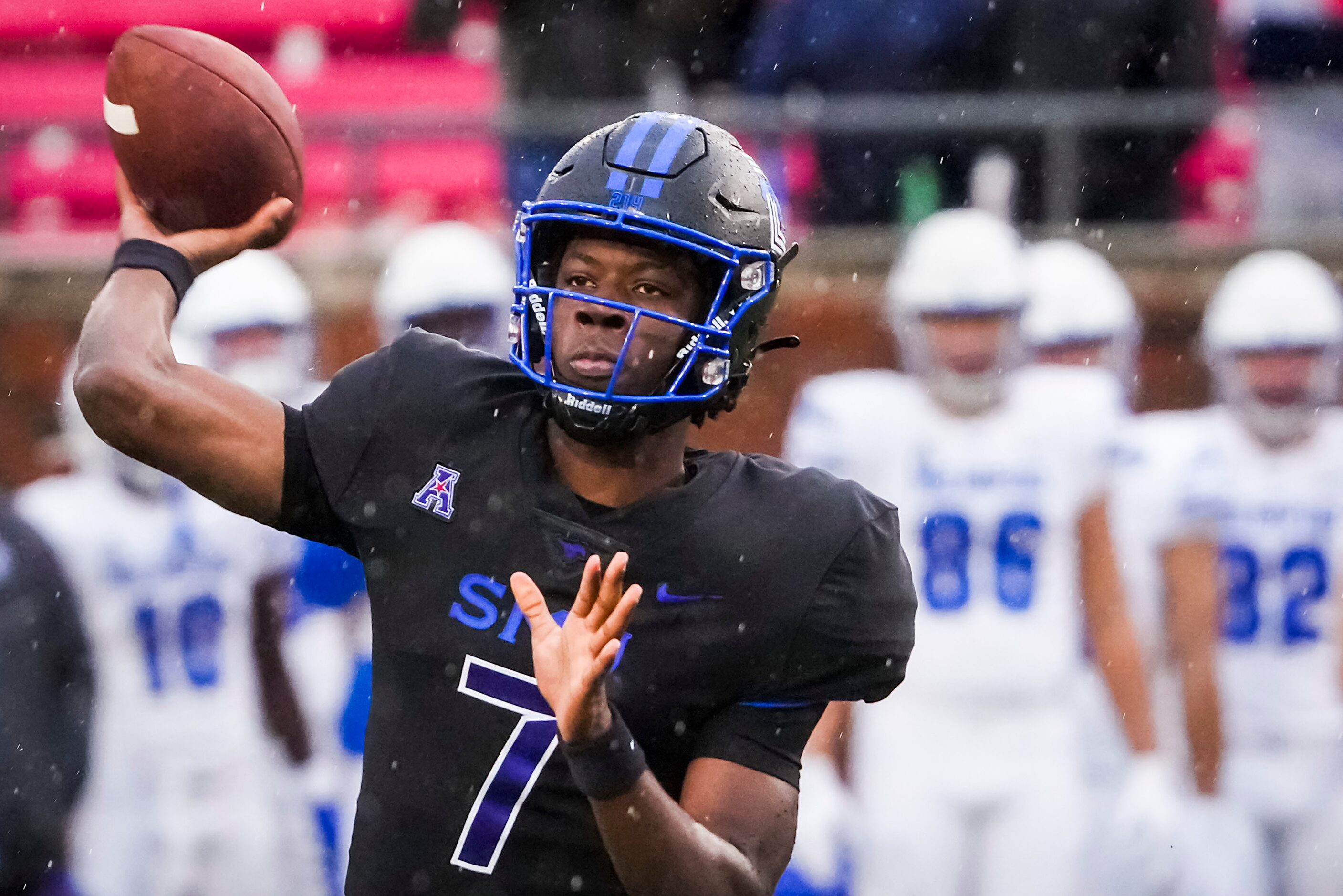 SMU quarterback Kevin Jennings (7) throws a pass during the first half of an NCAA football...