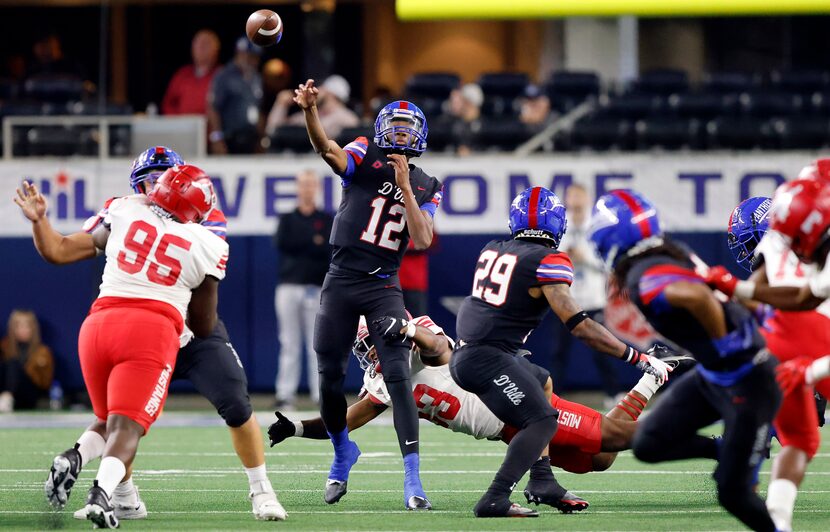 Duncanville quarterback Keelon Russell (12) throws a long pass to wide receiver Dakorian...