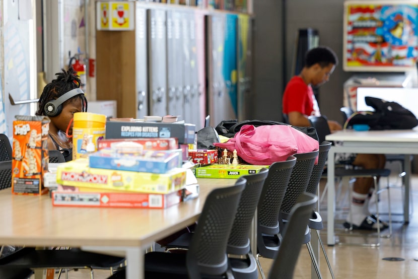 Youths work on laptops at After8ToEducate at Fannie C. Harris Youth Center on a recent...