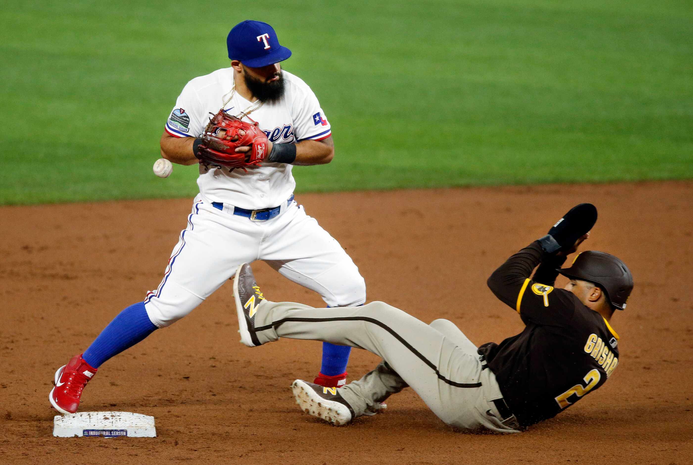 San Diego Padres Trent Grisham (2) slides safely into second as Texas Rangers second baseman...