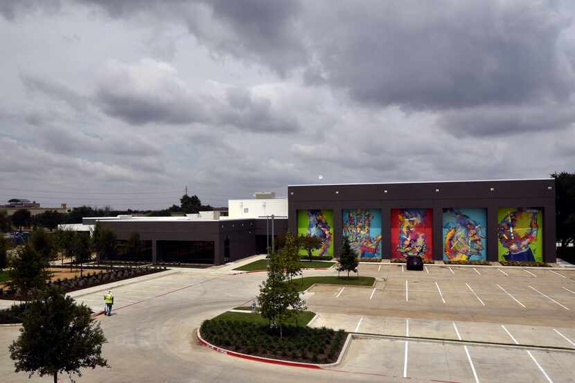 Murals by Spanish artist Adrian Torres decorate the fitness center (right) on the campus of...