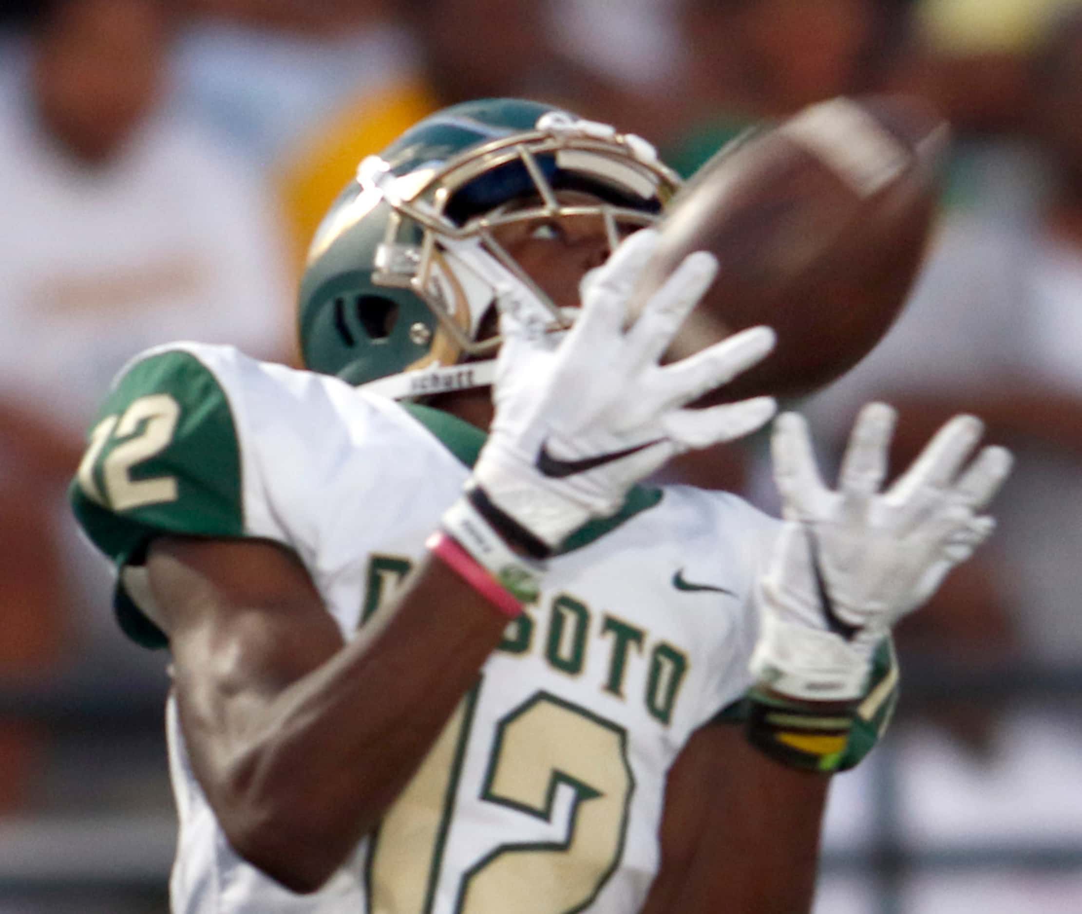 DeSoto receiver Jaedon Wilson (12) pulls in a 70-yard touchdown reception during second...