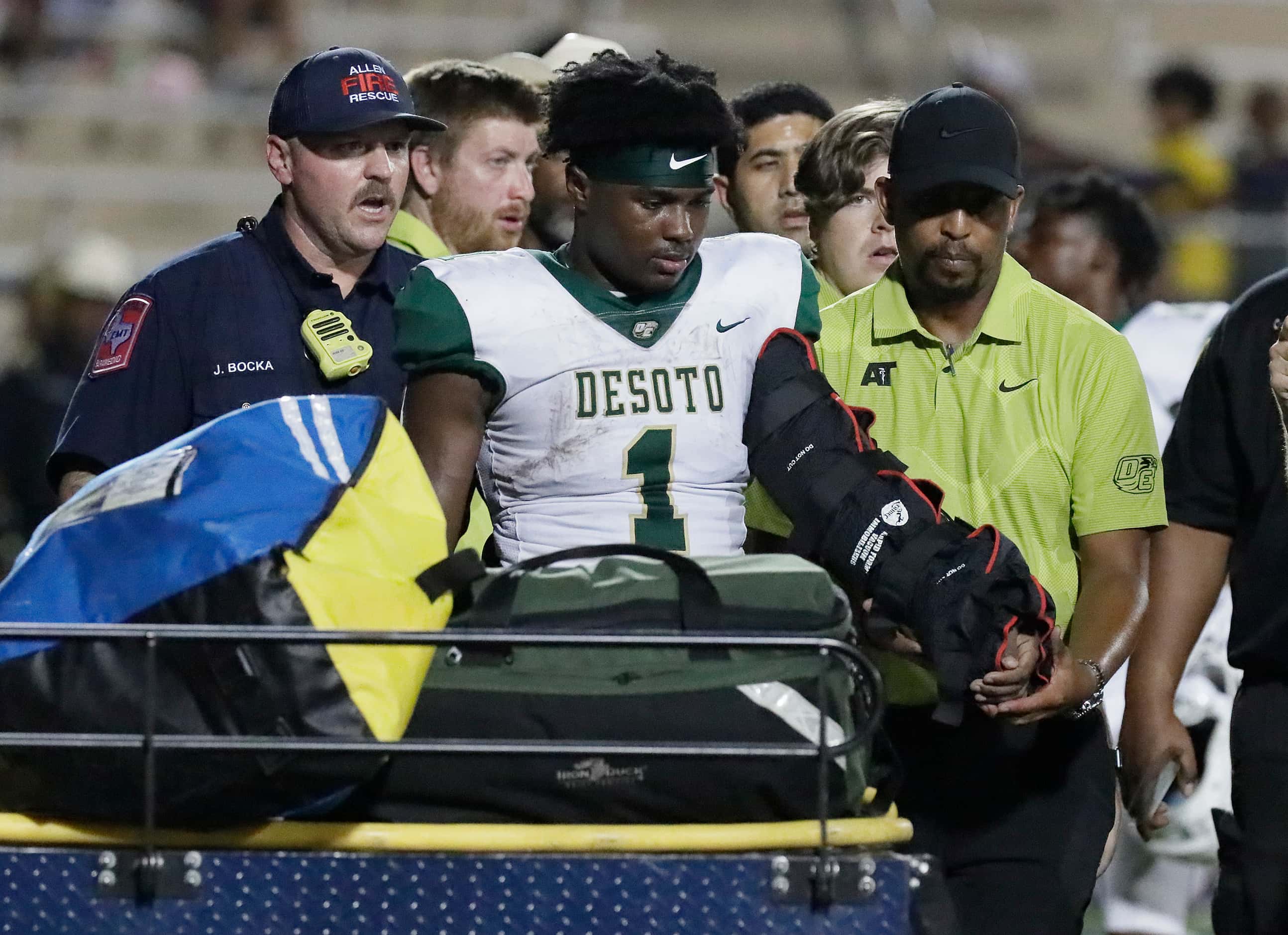 DeSoto High School running back Deondrae Riden jr. (1) was carted off of the field with his...