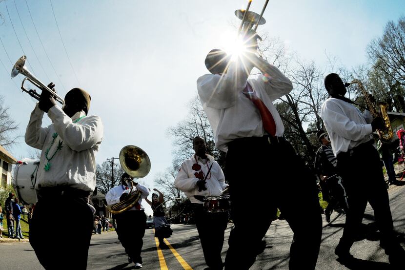 The Red and Black Brass band during the Krewe of Highland Mardi Gras parade on Creswell...