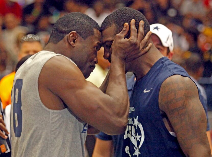 Team Captain Michael Irvin (left) gives an old fashioned stare-down to Team Captain Dez...
