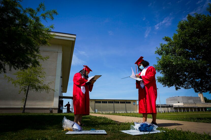 Andrea Soto (left) and Samanta Zuniga, seniors at Skyline High School, signed each other’s...