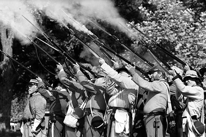 Re-enactors fire their guns to  honor and salute Confederate heroes at the third annual...