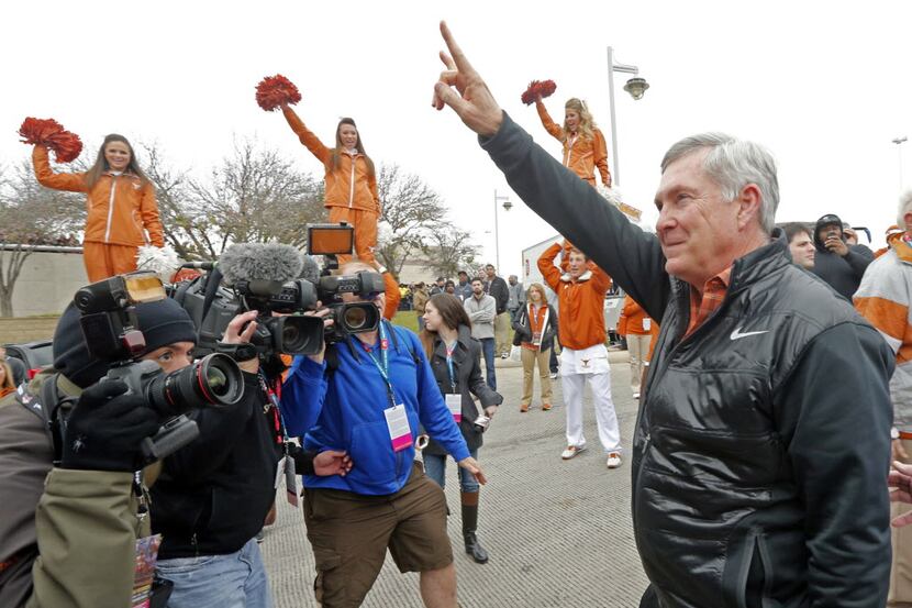 Texas Longhorns head coach Mack Brown greets fans as he enters the Alamodome prior to the...