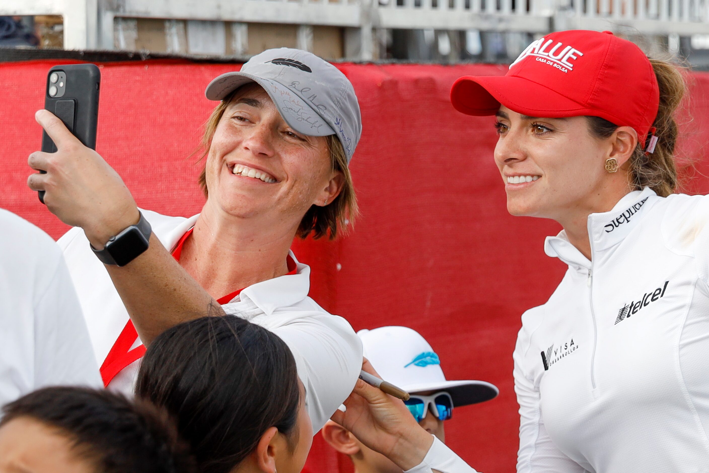 Professional golfer Gaby Lopez poses for a selfie with a fan after completing the final...