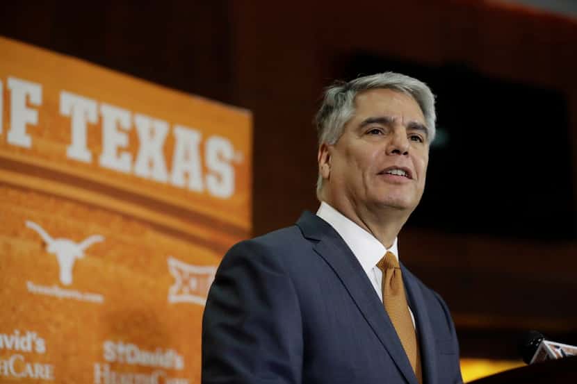 Texas president Greg Fenves speaks at a news conference where he introduced Chris Del Conte...