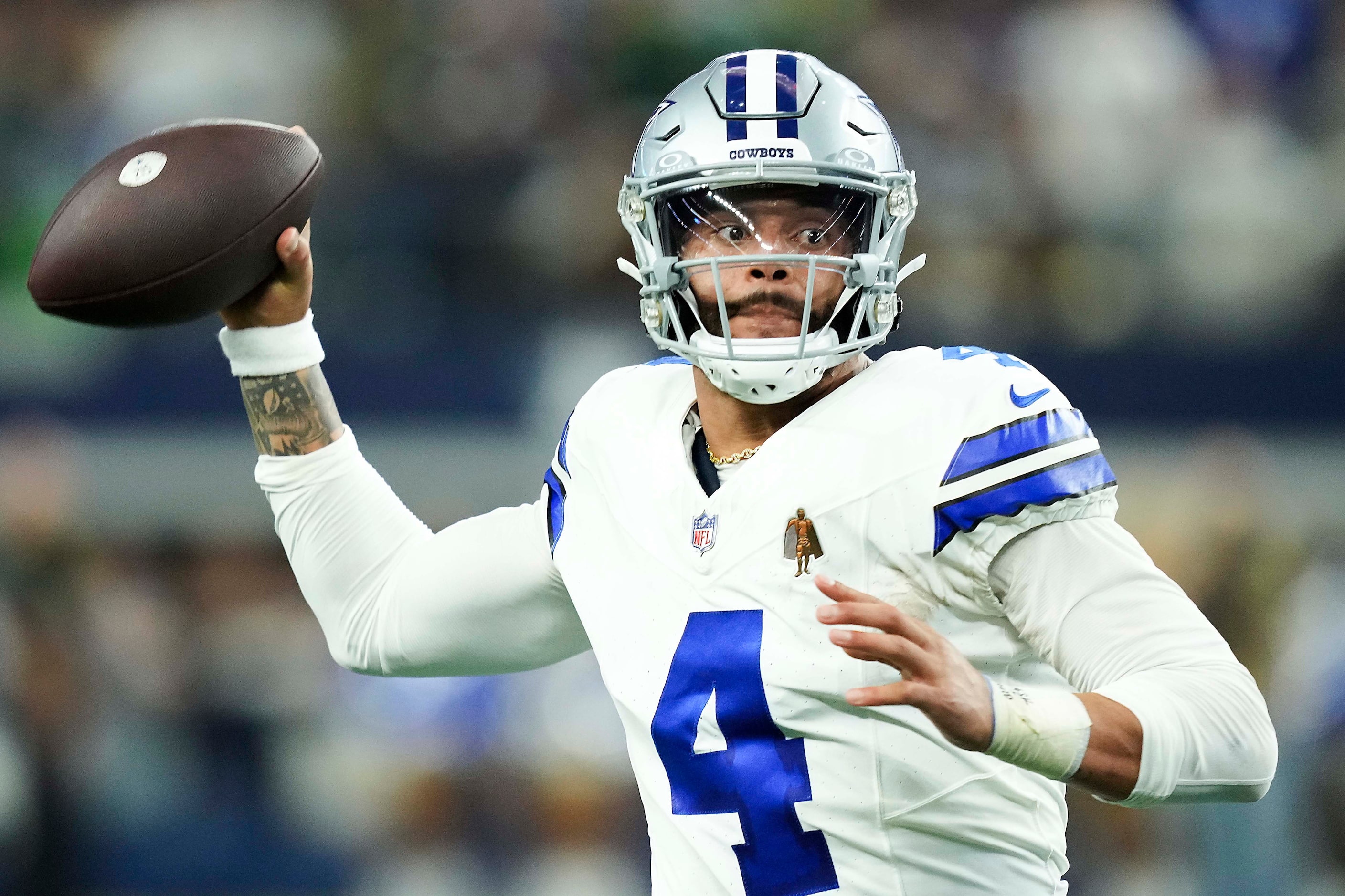 Dallas Cowboys quarterback Dak Prescott (4) throws a pass during the second half of an NFL...