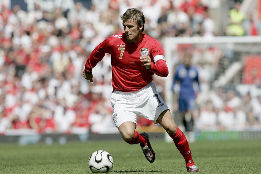 FILE- In this June 3, 2006, file photo, England's David Beckham dribbles the ball against...