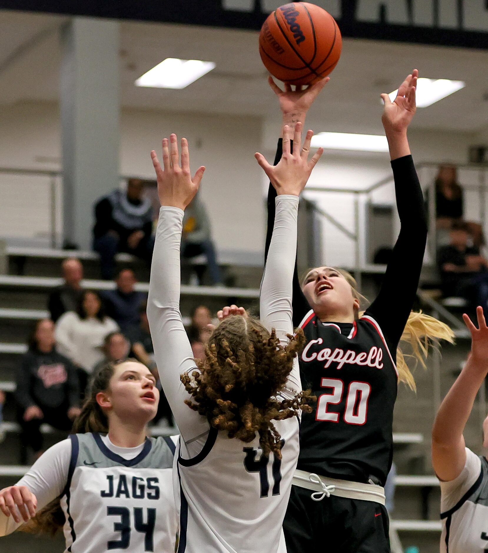 Coppell guard Julianna Lamendola, (20) shoots over Flower Mound guard Kaitlyn Edmondson (41)...