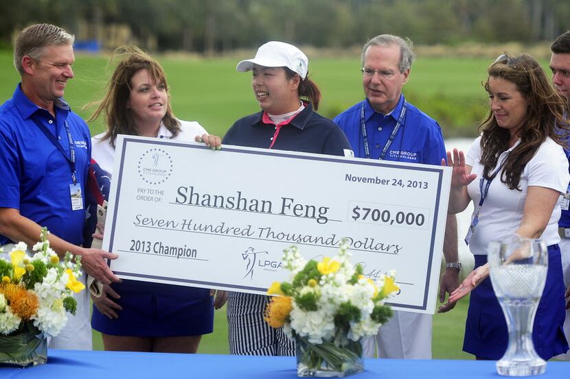 Shanshan Feng is holds her oversized novelty check after  capturing the CME Group...