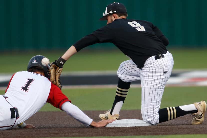 Rockwall Heath's Casey Curtin (1) jars the ball loose from the tag of The Colony shortstop...