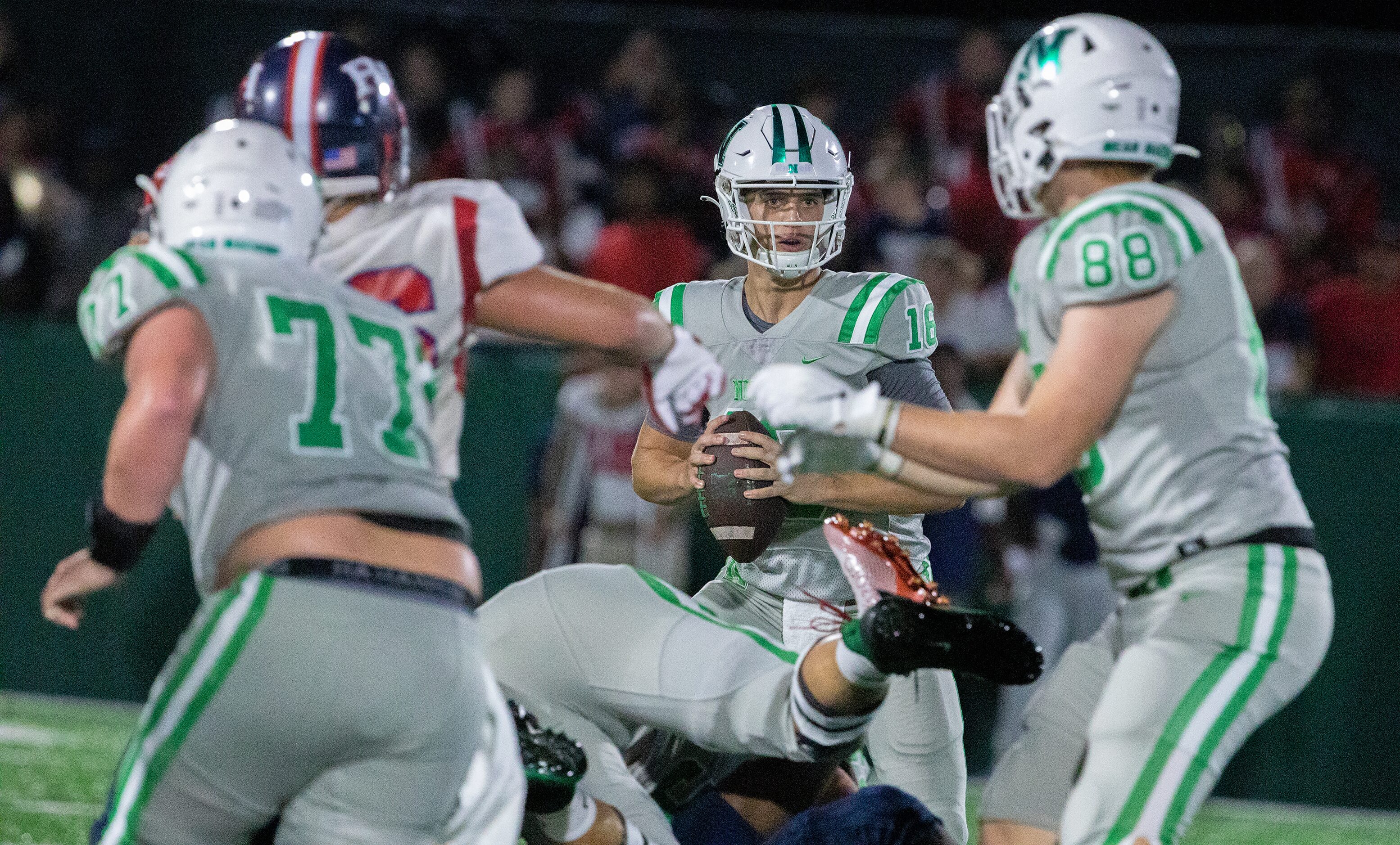 Arch Manning looks for receiver tight end Will Loerzel (88) as Newman High School takes on...