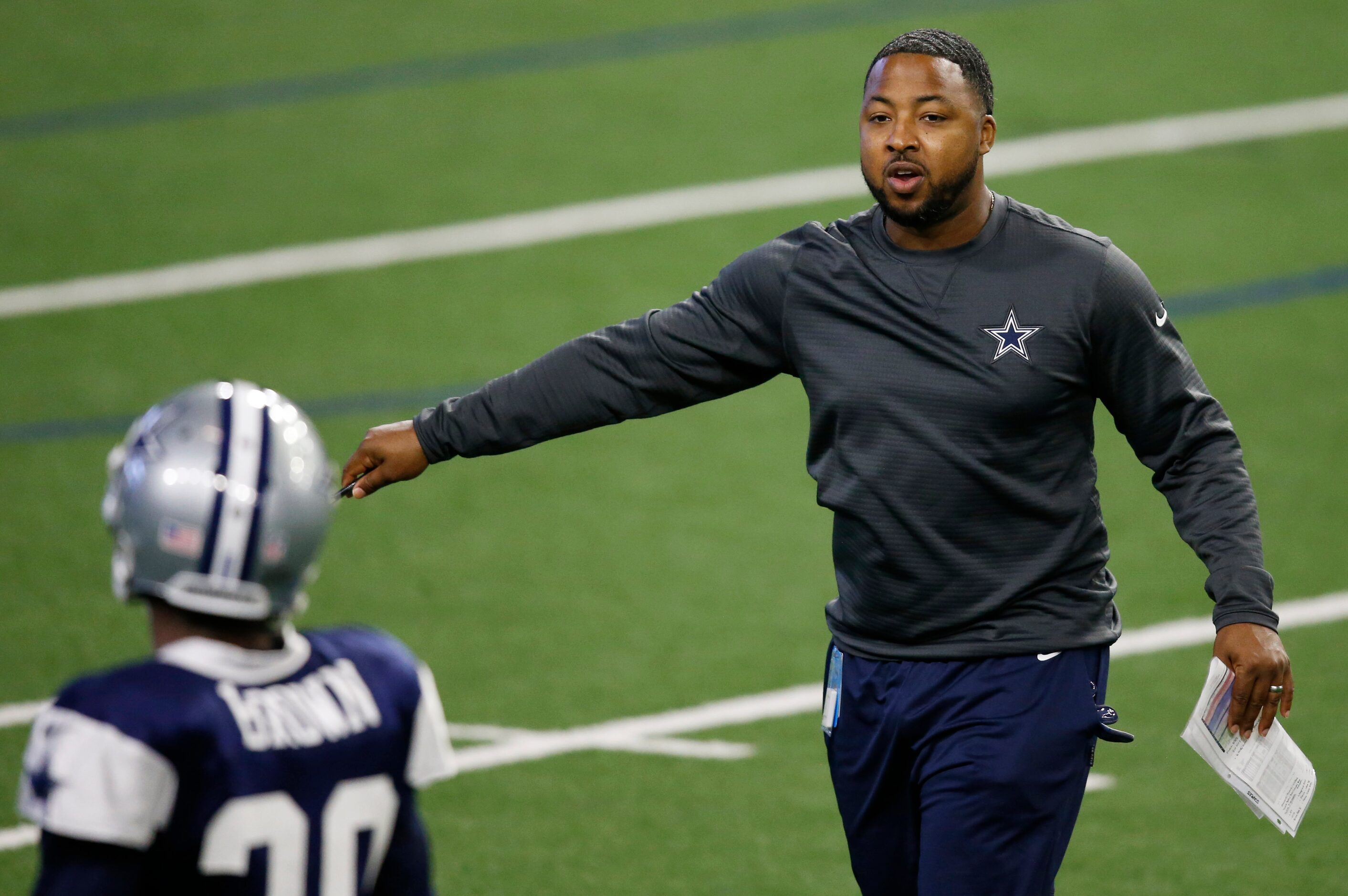 Dallas Cowboys defensive backs coach Maurice Linguist talks to Dallas Cowboys cornerback...