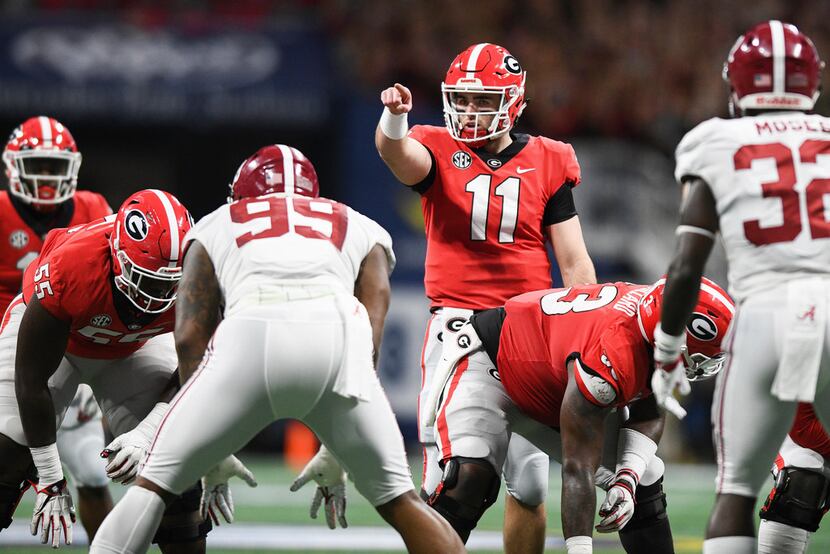 Georgia quarterback Jake Fromm (11) points during an NCAA college football game against...