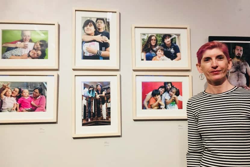The photographer Olivia Peregrino poses with her photos during the art show MaricónX...