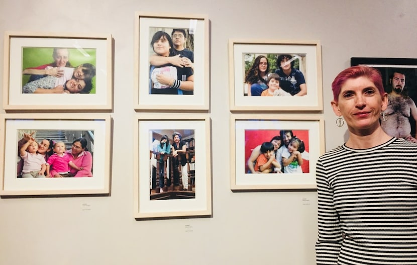 The photographer Olivia Peregrino poses with her photos during the art show MaricónX...